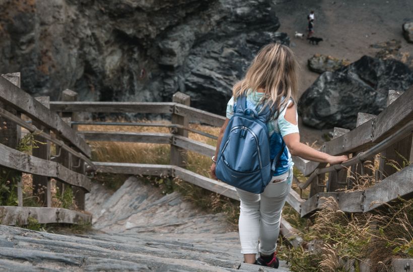 coastal walker going down to the beach at Tintagel