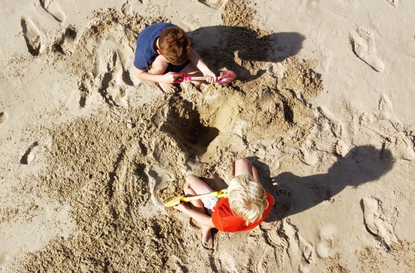 image of children playing on a Cornish beach